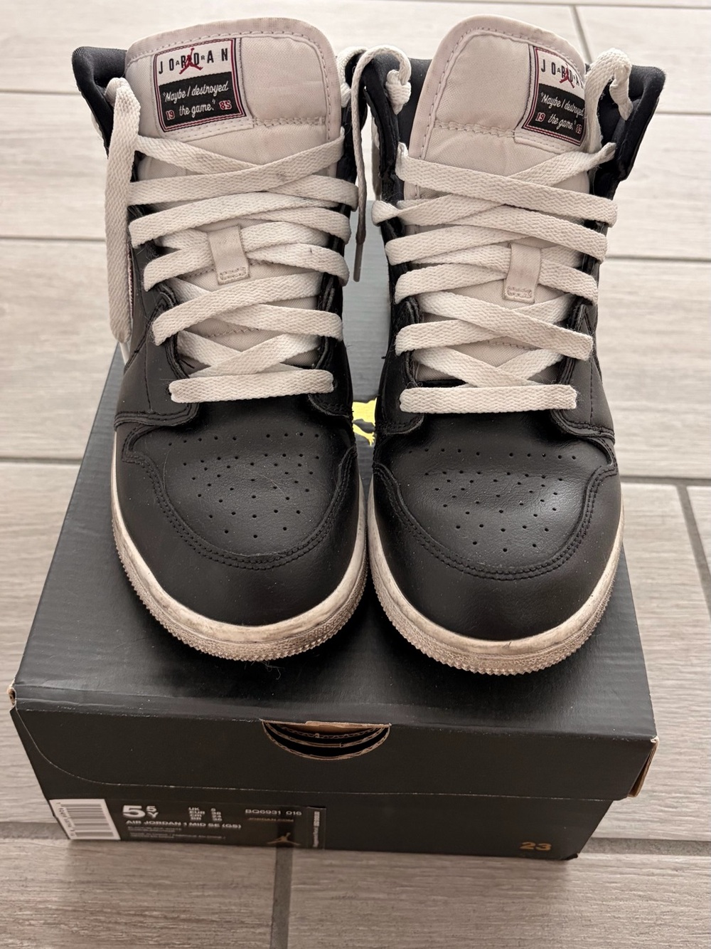 Jordan Mid/High-Top Sneakers in Black and Cream